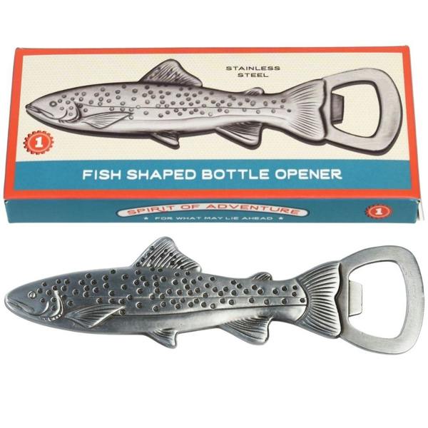 A silver stainless steel bottle opener shaped like a spotted trout fish, displayed next to its retro blue and red illustrated cardboard packaging box.
