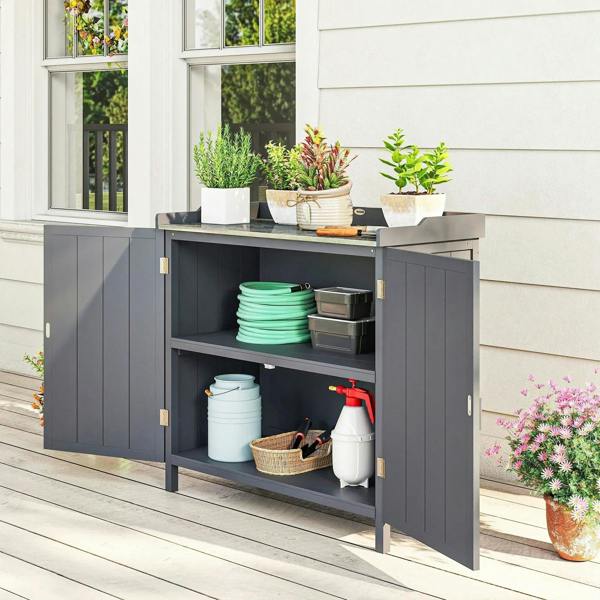 Grey two-shelf storage cabinet with doors open, holding yard supplies