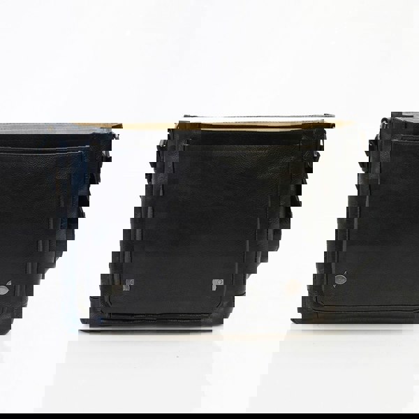 black leather messenger bag is open to show a front slip pocket and a magnetic button closure for the top flap.