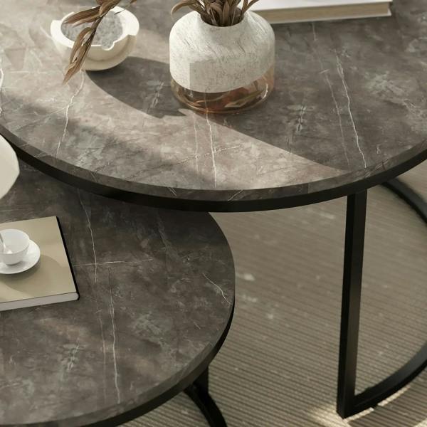 Close-up of dark grey faux-marble round coffee table top with black steel edge