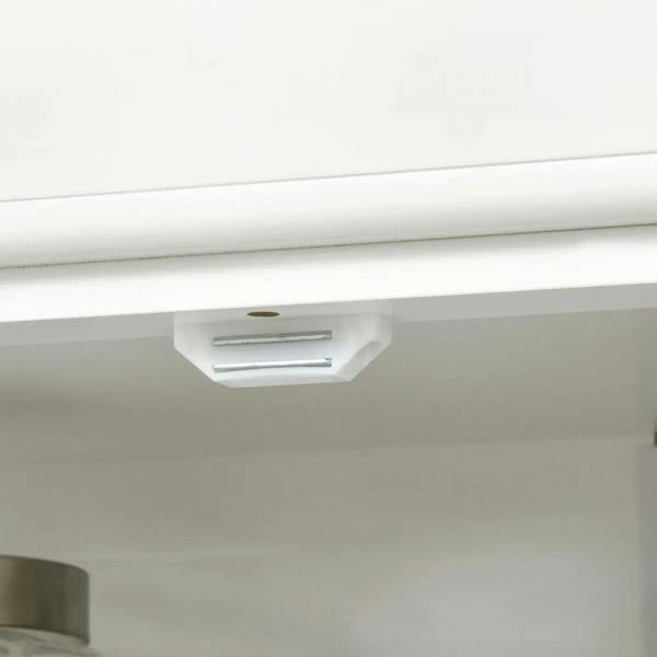 White cabinet door latch with metal pull, shown from underneath