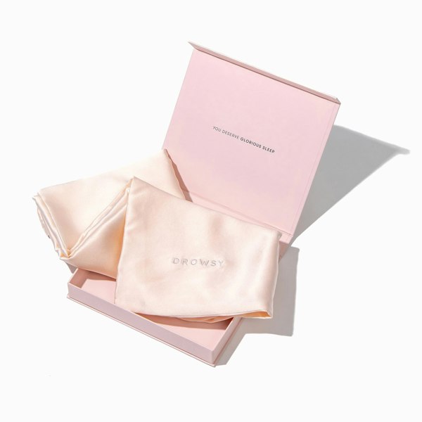 Baby pink pillowcase box opening with baby pink silk pillowcase inside