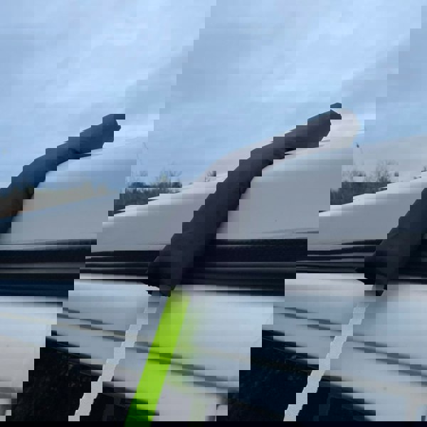 The 3 pcs Tent protectors for awning Straps on a white background and being used on a Volkswagen Campervan.