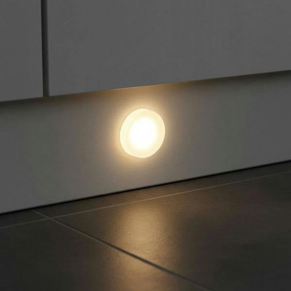 under plinth light shown recessed into a white kitchen kickboard 