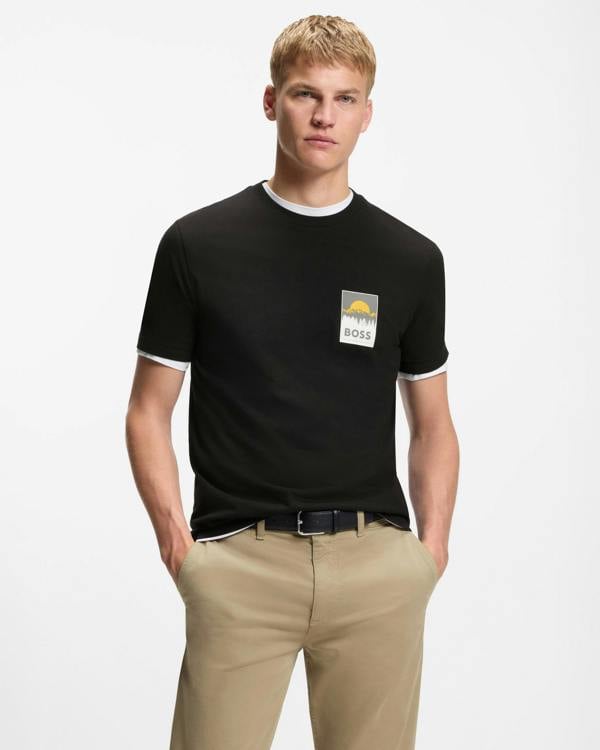 Model wearing BOSS Orange TePlain Mens Cotton-Jersey T-Shirt with Logo Artwork in Black 001 - Front
