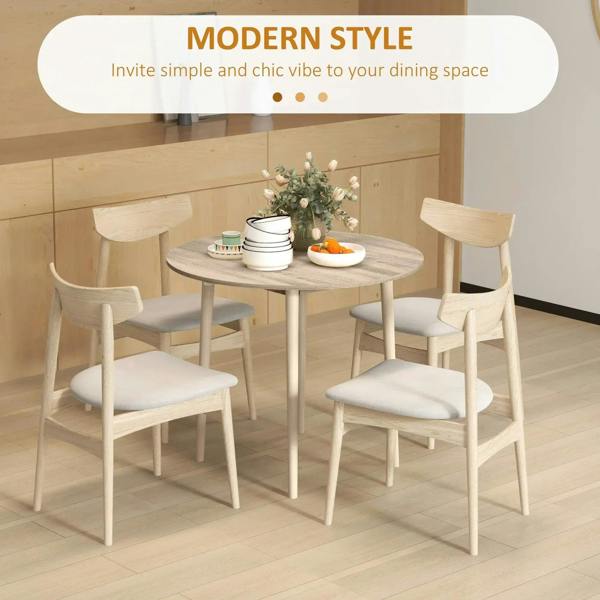 Round drop-leaf dining table with natural wood top and four matching legs