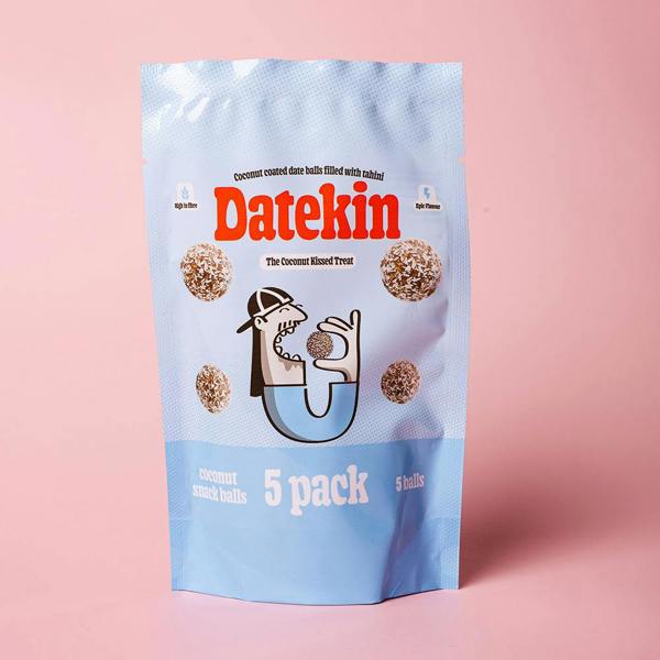 Blue packaging of Datekin coconut snack balls on a pink background