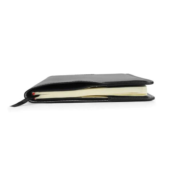 Black leather diary cover with a white interior on a white background