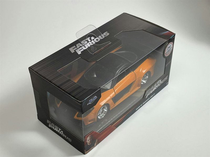 a toy car in a box