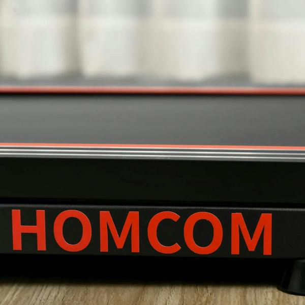Black treadmill deck side with red trim and HOMCOM logo
