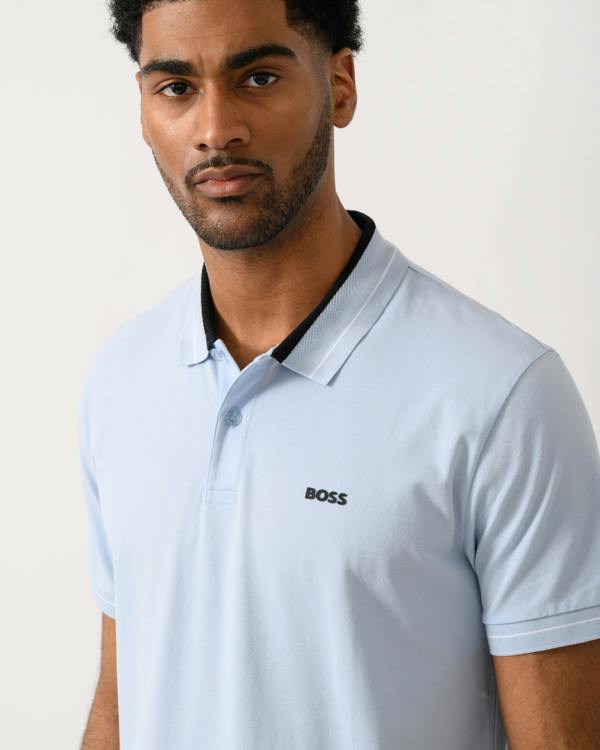 close up shot of a Model wearing a BOSS Green PL_Member Mens Short Sleeve Polo Shirt in Open Blue 460