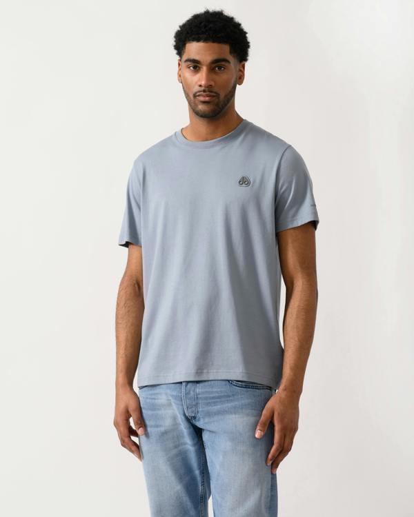 model wearing a Moose Knuckles Crescent Mens T-Shirt in Jet Stream 1884