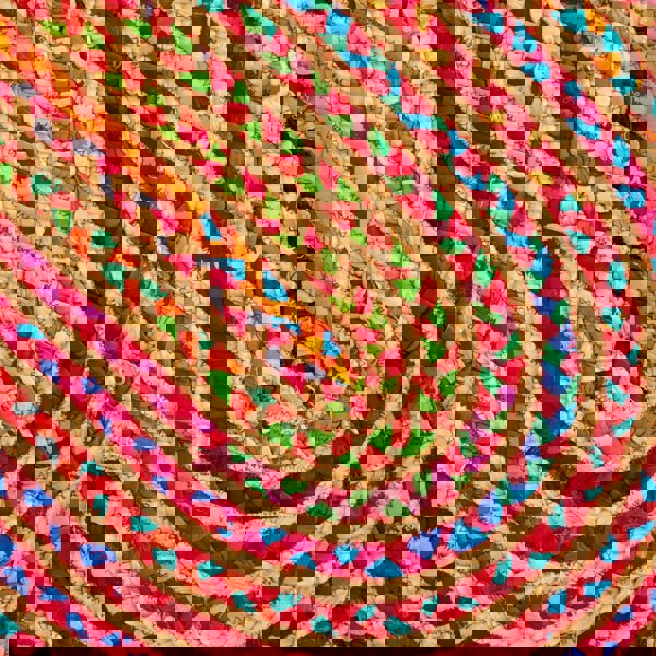 A Multicoloured Jute and Cotton Oval Rag Rug in a circular shape.