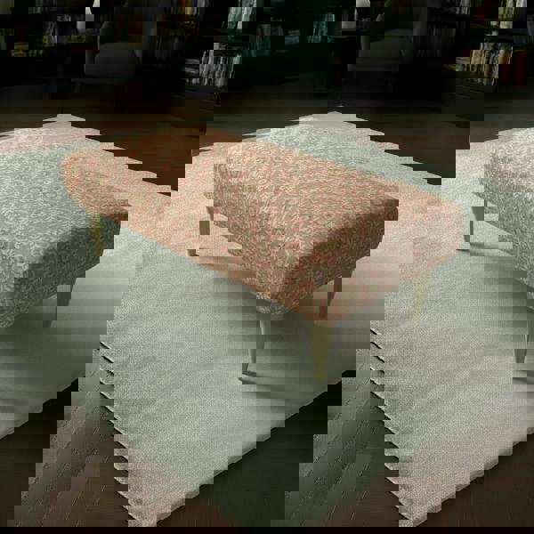 Fixed top rectangular ottoman with vibrant multi-toned abstract designer fabric and elegant wooden legs