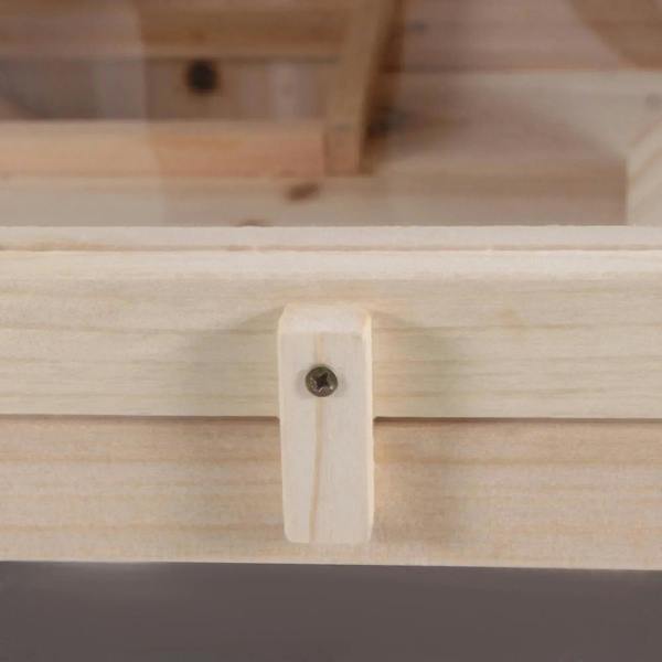 Natural wood corner joint with metal screw detail on a rodent hutch