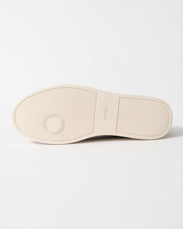 sole studio shot of BOSS Orange Kieran Mens Grained-leather trainers with white rubber sole in Black 008