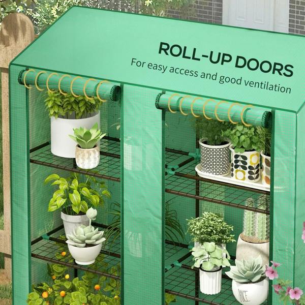Green mini greenhouse with roll-up doors open, showing wire shelves and potted plants