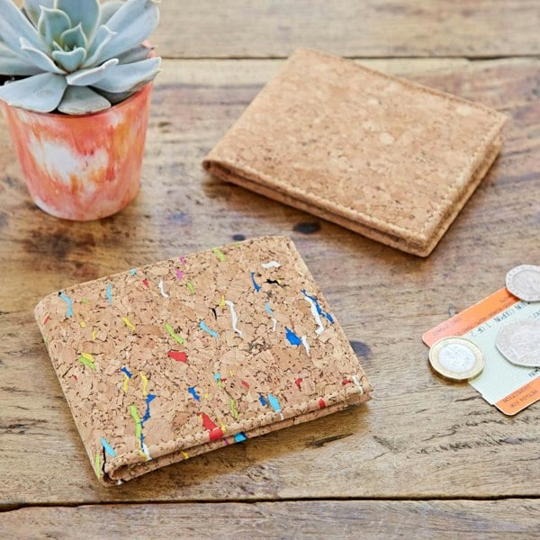 A Natural Cork Billfold Wallet with a plant and money next to it.