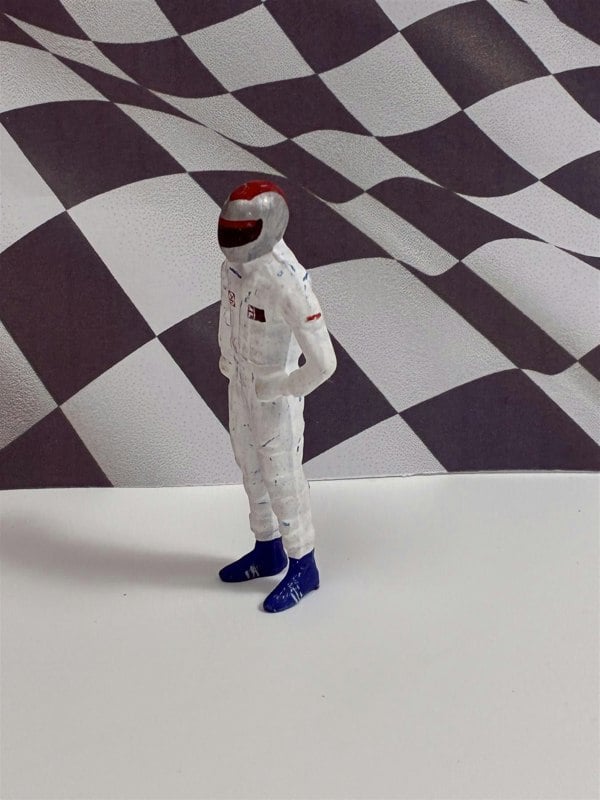 a toy astronaut in a white suit