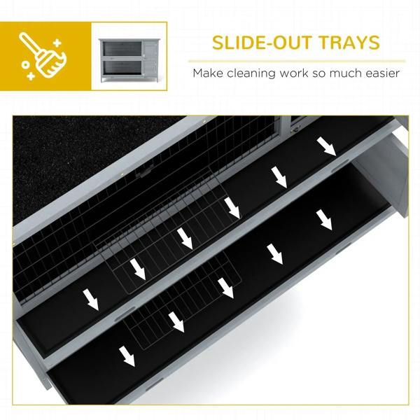 Grey rabbit hutch showing slide-out trays beneath wire compartments