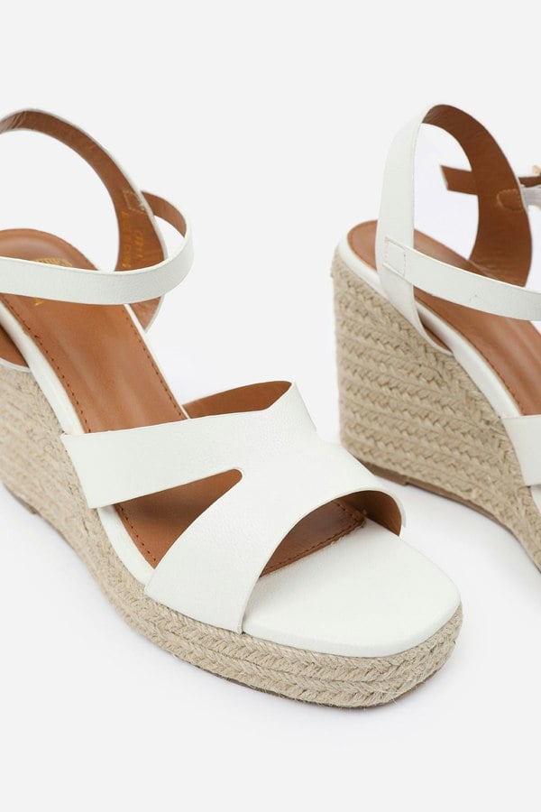 Where's That From Sansa Wide Fit Cut Out Strap Detail Wedge Shoes With Buckle Closure in White Grain Pu