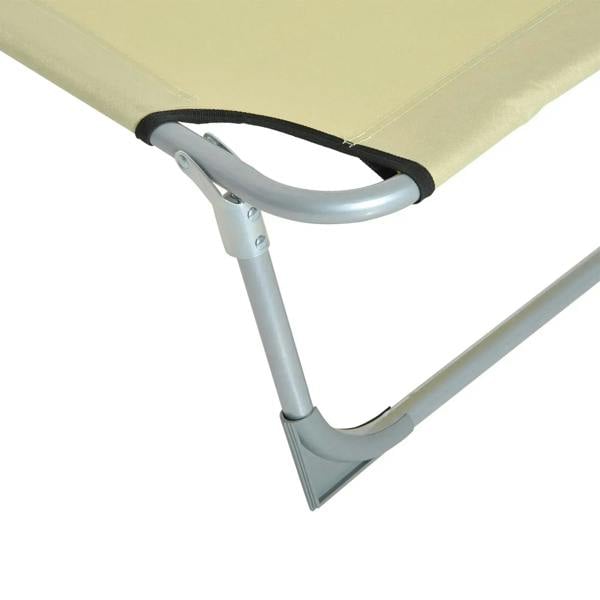 Beige lounger chair with black strap and gray tubular steel leg supports