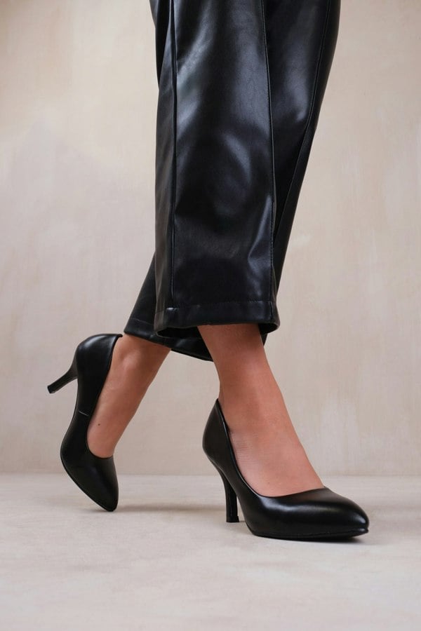 Where's That From Paola Mid High Heel Court Pump Shoes With Pointed Toe in Black Faux Leather