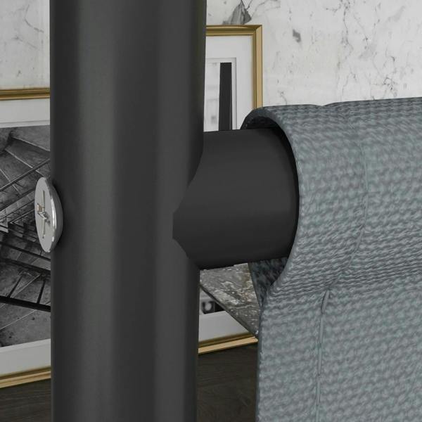 Dark grey privacy screen caster wheel and metal frame post beside sofa