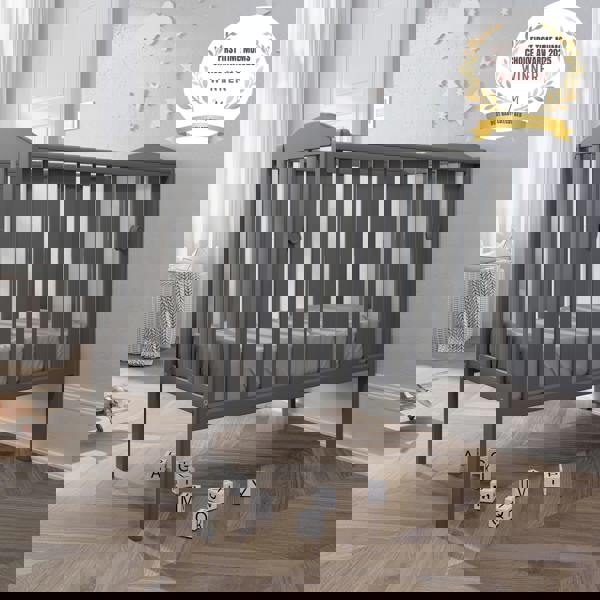 award badge - best baby cot - waffi mini space saver cot with drop side