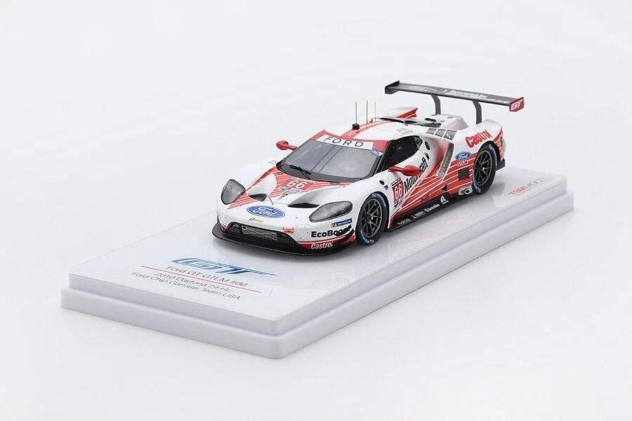 a toy race car on a white surface