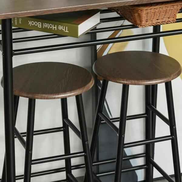 Close-up of two round dark wood stool seats and black frames beneath table shelf.