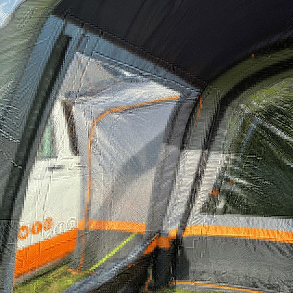 An image of the OLPRO Charcoal & Orange Cocoon Breeze Campervan Awning Extension attached to the Cocoon Breeze that has been fixed to a VW Campervan.