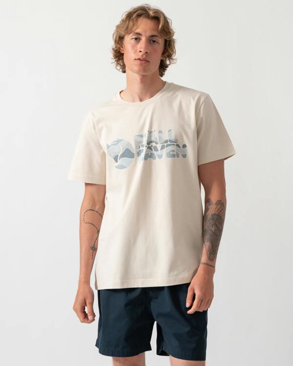 model wearing a Fjallraven Multicolor Logo Mens T-Shirt in Chalk White 113