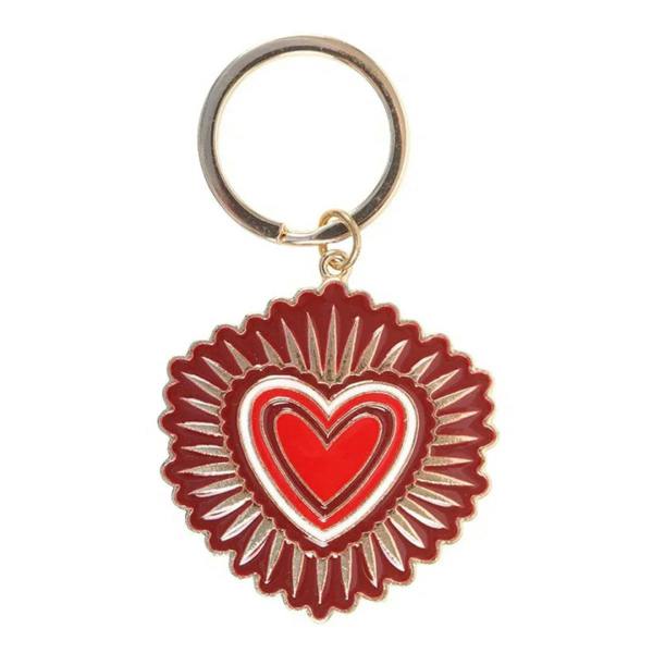 Sacred Heart keyring close-up with red heart in ornate scalloped medallion