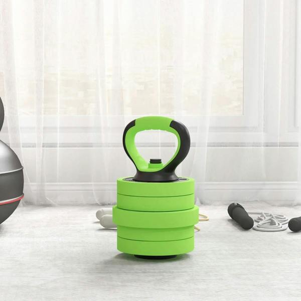 Green kettlebell formed by stacked plates with a black ring handle