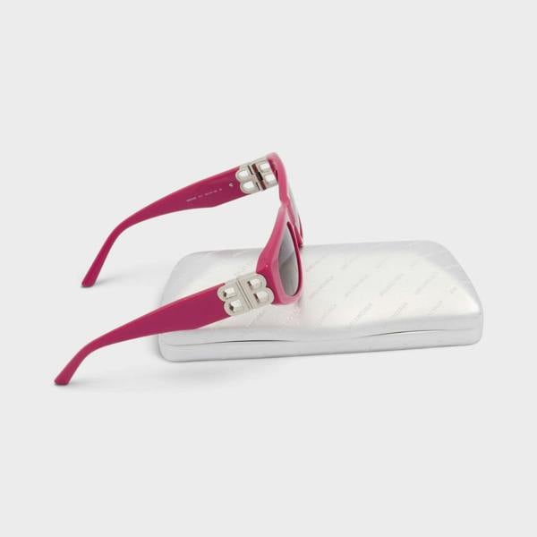 Supplied Fashion pink cat eye sunglasses with silver logo plaque on the temple, resting on a metallic silver case.