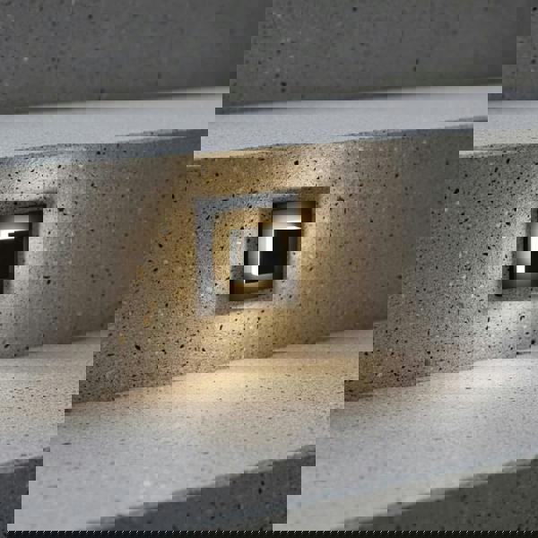 black flush outdoor wall light mounted in outside concrete steps 