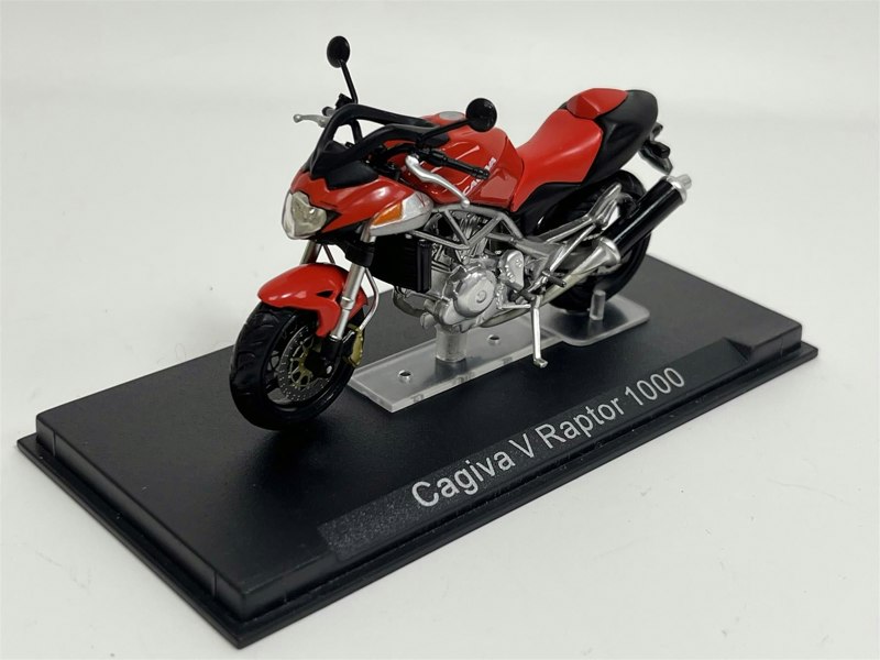a red and black motorcycle on a black stand
