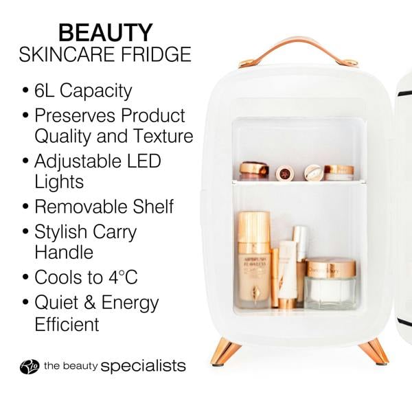 The Rio Beauty Skincare Fridge With Mirror is a compact white fridge with rose gold accents. Open shelves display chilled cosmetics and creams. Features include 6L capacity, 4°C cooling, LED lights, a removable shelf, and portable design.