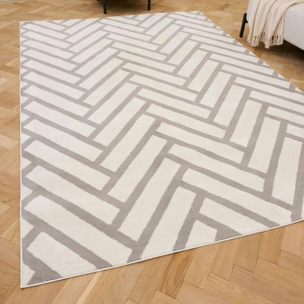 Geometric patterned rug on a wooden floor