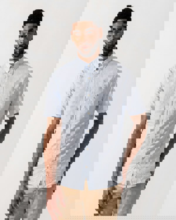 Model wearing a GANT Mens Regular Fit Classic Poplin Gingham Short Sleeve Shirt in 455 Light Blue - Main