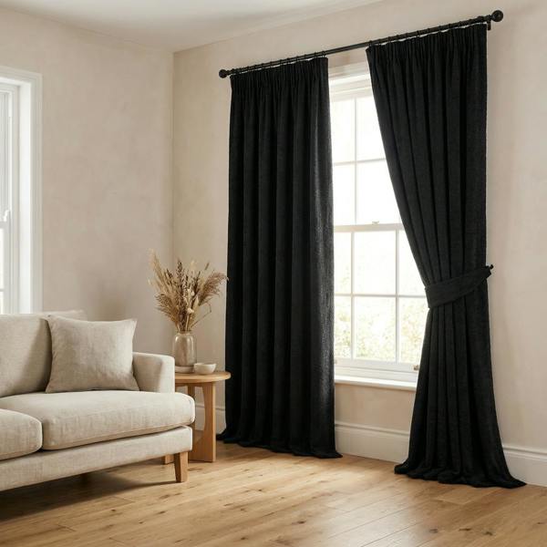 Tuvalu made-to-measure curtains in Onyx, styled in a living room