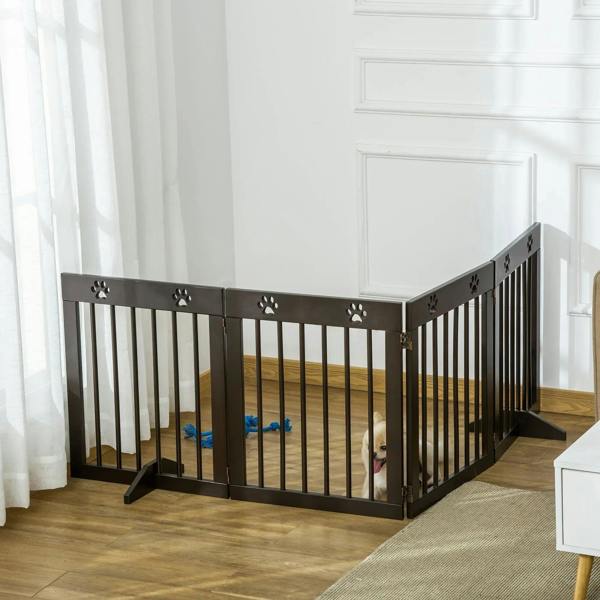 Brown wooden pet gate folded into an L shape with paw print top accents