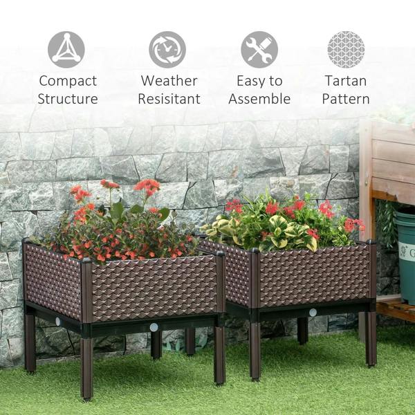 Pair of brown raised planter boxes on legs with colorful flowers inside