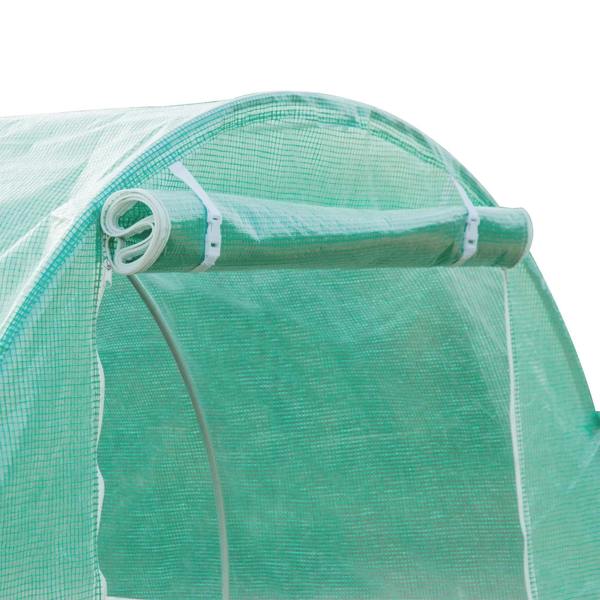 Green mesh greenhouse cover with metal support bars and fasteners at roof edge