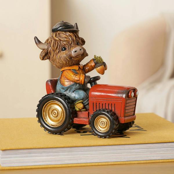 Country Living Highland Cow on Tractor