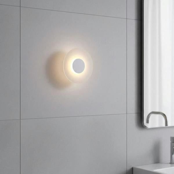 white IP65 bathroom wall sconce mounted on tiles on a modern bathroom wall 