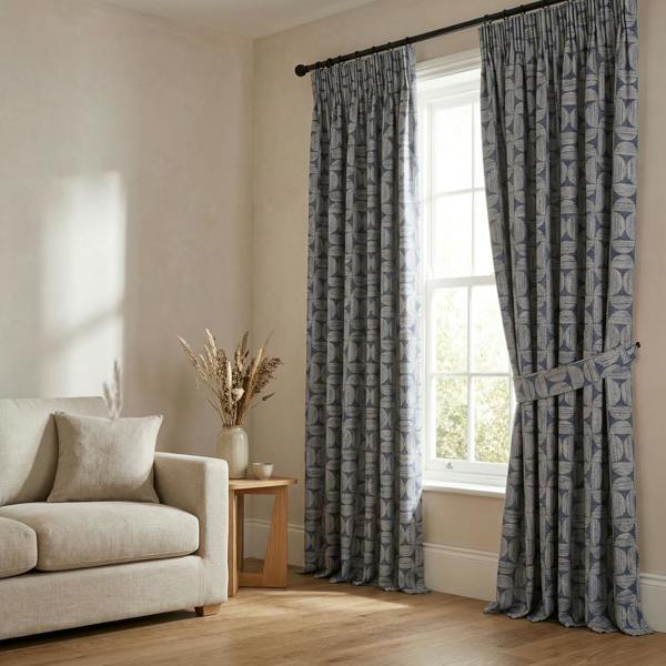 Axel made-to-measure curtains in Denim, styled in a living room