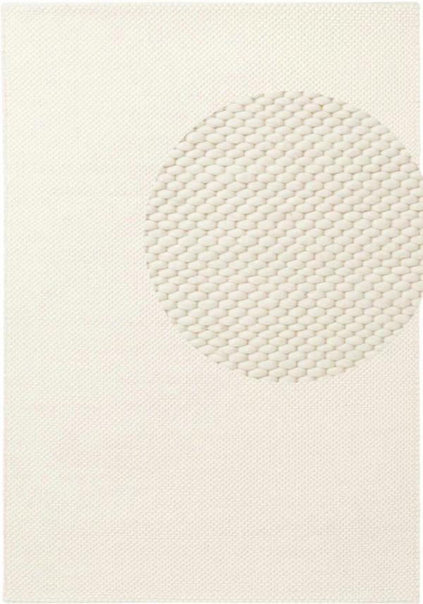 Textured white rug with geometric pattern on a plain background