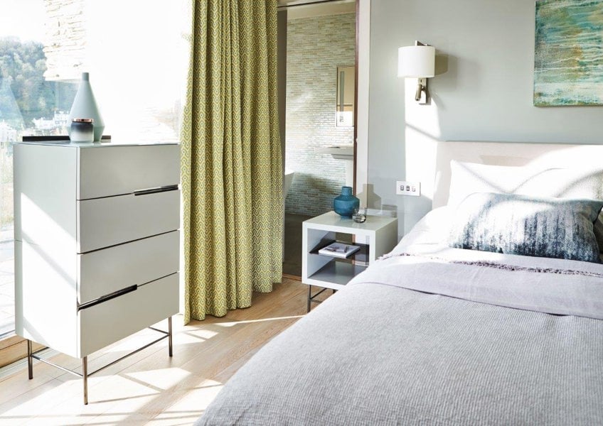 Alberto Narrow chests next to window